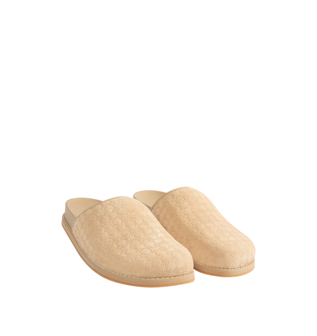 Image 2 of 4 - NEUTRAL - Amiri Mens Clog Slides are crafted from embossed suede leather material. Feature a closed upper, tone-on-tone engraved monogram motif, tapered wraparound construction, and flat rubber outsole with a lightly lugged tread. Upper: Suede Leather; Outsole: Rubber. Made in Vietnam.