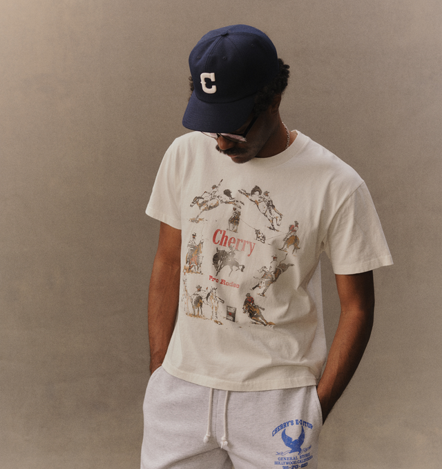 Image 4 of 5 - CREAM - Cherry LA Men's Pro Rodeo Classic T-Shirt is crafted from cotton and features a classic-fit silhouette with a rib-knit crew neckline and short sleeves. Designed with a screen-printed graphic at the front, this everyday essential channels Western-inspired style through Cherry LA's signature graphic aesthetic. Main Material: Cotton. Made in Los Angeles, California.