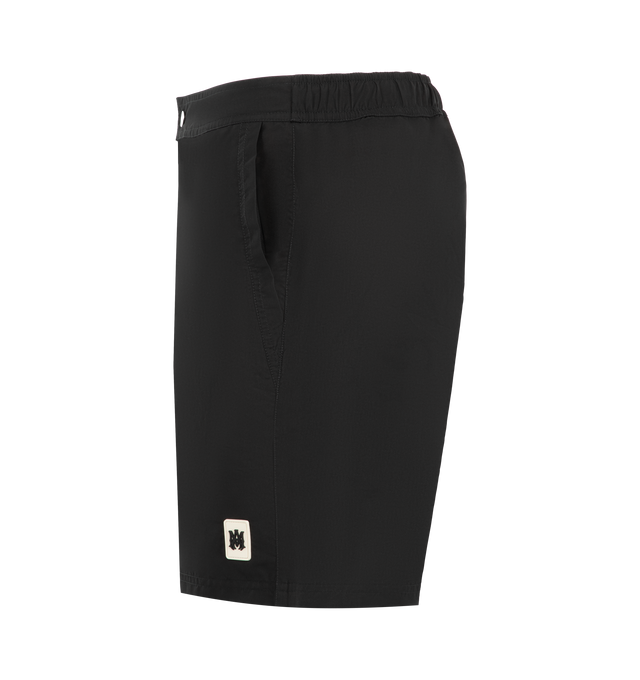 Image 3 of 3 - BLACK - Amiri Mens Logo Swim Trunks are crafted from lightweight technical fabric. Feature an elasticized waistband with adjustable drawcord, side seam pockets, and a relaxed fit. Main Material: 100% Polyester. Made in Bangladesh.