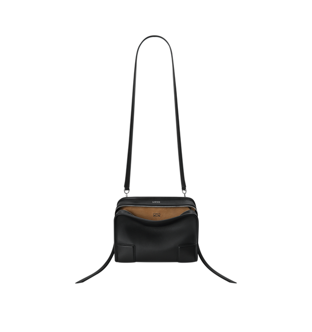 Image 10 of 16 - BLACK - Loewe Small Amazona 180 Bag in leather features a relaxed silhouette anchored by a single toron top handle, designed to be carried open, while a concealed closure secures the main compartment, three carry options: short handle, removable shoulder strap and crossbody, zip closure with two leather zip pullers, two compartments, main compartment closed with magnetic closure, internal flat pocket, left side d-ring for customization, nappa lambskin lining, and embossed double L branding.