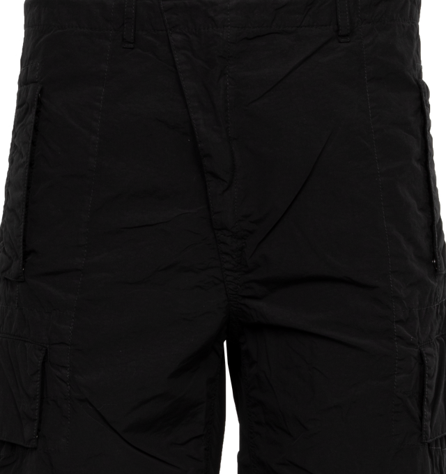 Image 4 of 4 - BLACK - C.P. COMPANY Flatt Nylon Oversized Cargo Pants featuring oversized fit, zip fly and button fastening, belt loops, slanted hand pockets, cargo pockets and lens detail. 100% polyamide/nylon. 