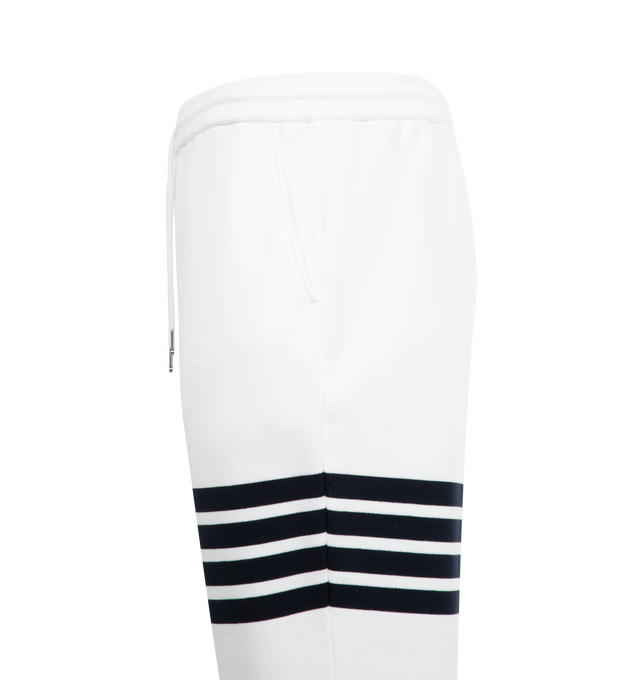 Image 3 of 3 - WHITE - THOM BROWNE Classic Loopback 4 Bar Sweatpants featuring iconic 4-bar detailing, pull-on, drawstring waistband with silver tone aglets, side slip pockets, name tag applique and signature striped grosgrain loop tab. 100% cotton. Made in Italy.