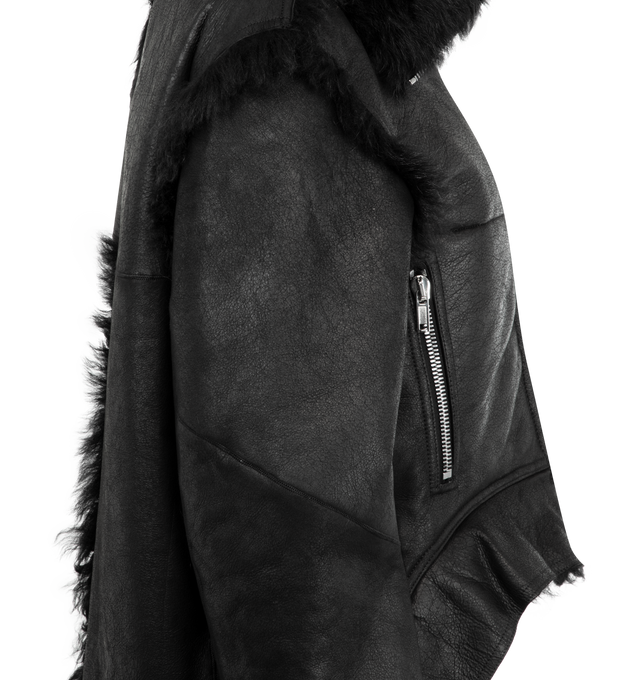 Image 3 of 3 - BLACK - RICK OWENS Exploder Jacket featuring used-effect worked leather, shearling lining, adjustable high collar as a collar on the shoulders, front zip closure, pockets, long sleeves with zip on the cuffs and asymmetrical hem. 87% wool 10% nylon 3% elastane. Made in Moldova.