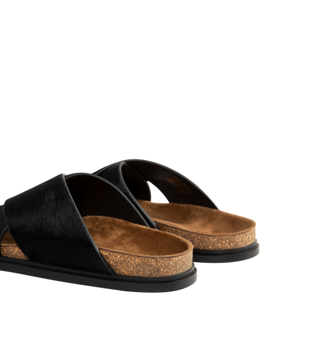 Image 3 of 4 - BLACK - The Row flat sandal in textured pony hair leather with wide overlapped upper straps, contoured cork footbed, and rubber sole. 100% Calfskin Leather. Made in Italy.