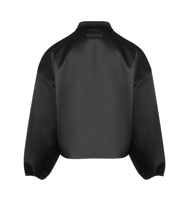 Image 2 of 2 - BLACK - FEAR OF GOD ESSENTIALS Bonded Satin Bomber made from a shiny, stretch fabric featuring a rounded, cropped bomber style with a mockneck, full front zip, slash pockets, elastic cuffs, and waist hem. A Fear of God Essentials rubberized label is stitched at the back collar. 94% polyester, 6% spandex.