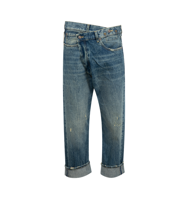 Image 1 of 3 - BLUE - R13 Crossover Jeans featuring fading, whiskering, and distressing throughout, belt loops, five-pocket styling, offset button-fly, raw edge at rolled cuffs and logo patch at back waistband. 100% cotton. Made in Italy.