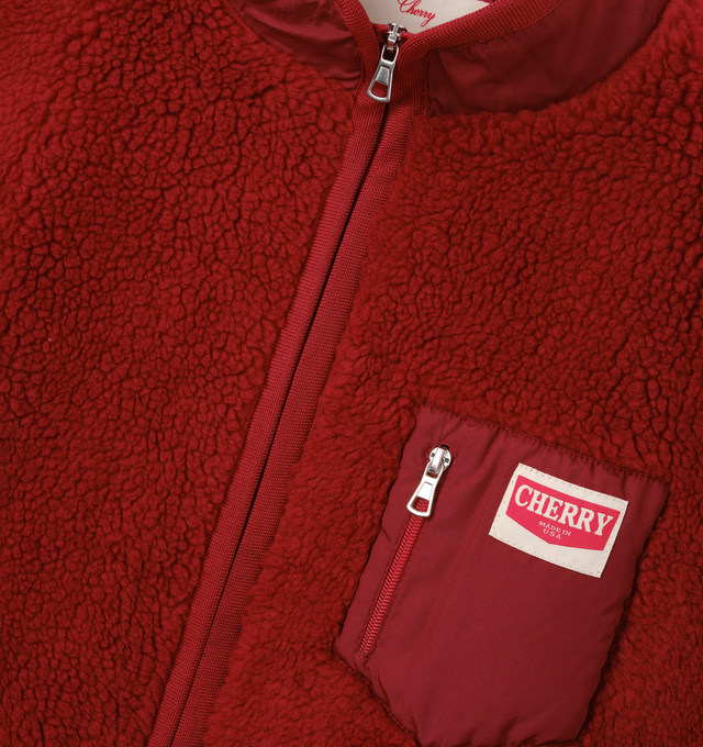 Image 3 of 6 - RED - Cherry LA Zip Up Sherpa Jacket is crafted from custom sherpa fleece and features a boxy-fit silhouette, a full-zip front closure, and zippered pockets for secure storage. Designed with elastic binding at the openings and signature chevron labels at the pockets, this cozy layer combines everyday comfort with clean utilitarian detailing. Main Material: Custom Sherpa Fleece