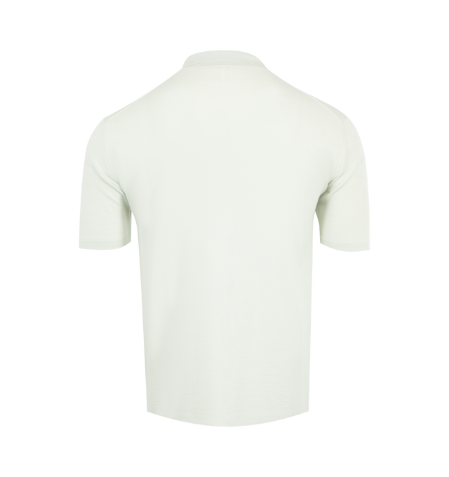 Image 2 of 2 - GREEN - THE ROW Mauro Top featuring short-sleeved polo top in ultrafine wool knit with slim fit, buttonless front tab, and signature center back detail. 100% wool. Made in Italy.