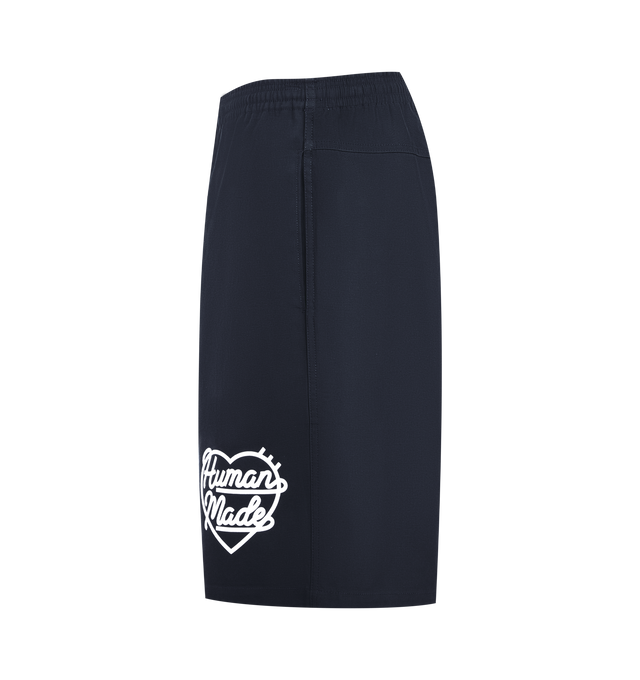 Image 3 of 3 - NAVY - HUMAN MADE Beach Shorts featuring shiny, firm cotton twill fabric, iconic heart logo on the front left hem, pockets on both sides and the right hip and waist cord with the brand logo. 100% cotton.