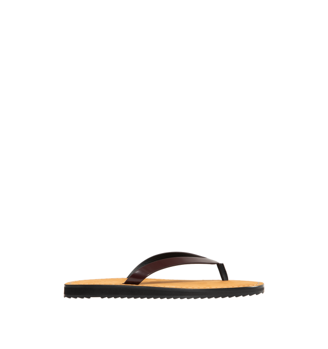 Image 1 of 4 - BROWN - THE ROW City Flip Flop featuring glossy calfskin leather with contrast leather footbed, stitched detailing, and lightly treaded rubber sole. 100% calfskin leather. Made in Italy.