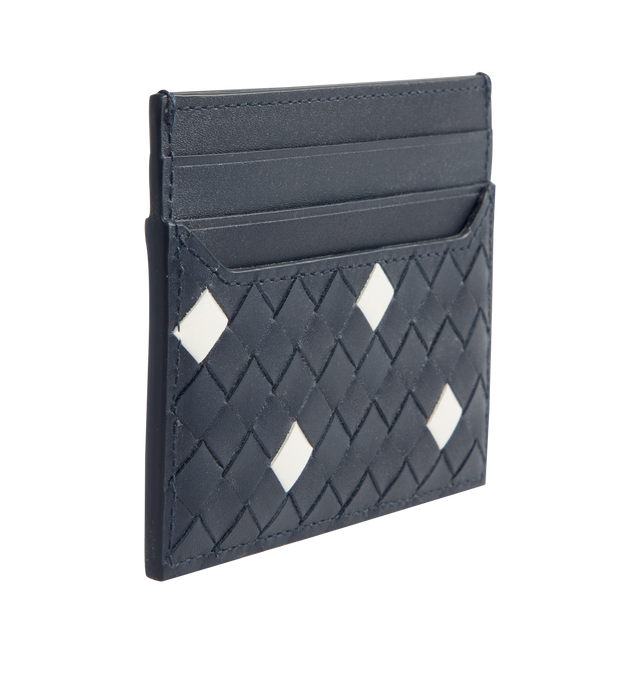 Image 2 of 3 - BLUE - BOTTEGA VENETA Intrecciato Piccolo Card Case featuring calf leather card case with polka dots, four card slots and one central pocket. The VN Preserve calf leather is realized through the BioBasedLeather process, which ensures a limited presence of petrol-based components and exclusive reliance on renewable energy sources. Calfskin. 3.1" x 4.1" x 0.2". Made in Italy.