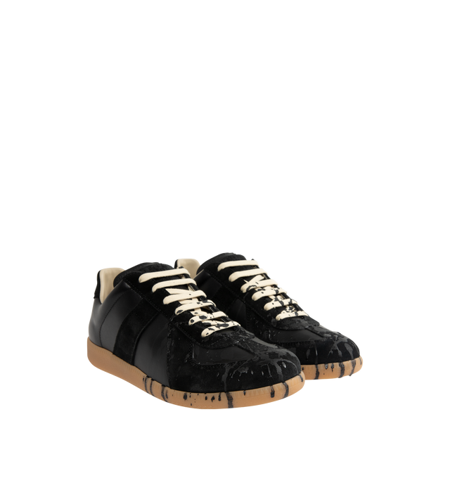 Image 2 of 5 - BLACK - MAISON MARGIELA Replica Sneakers featuring a classic low-top silhouette, contrast of matte leather and a patent sprayed finish, paint splatter detail, lace-up construction and rubber sole. Made in Italy.