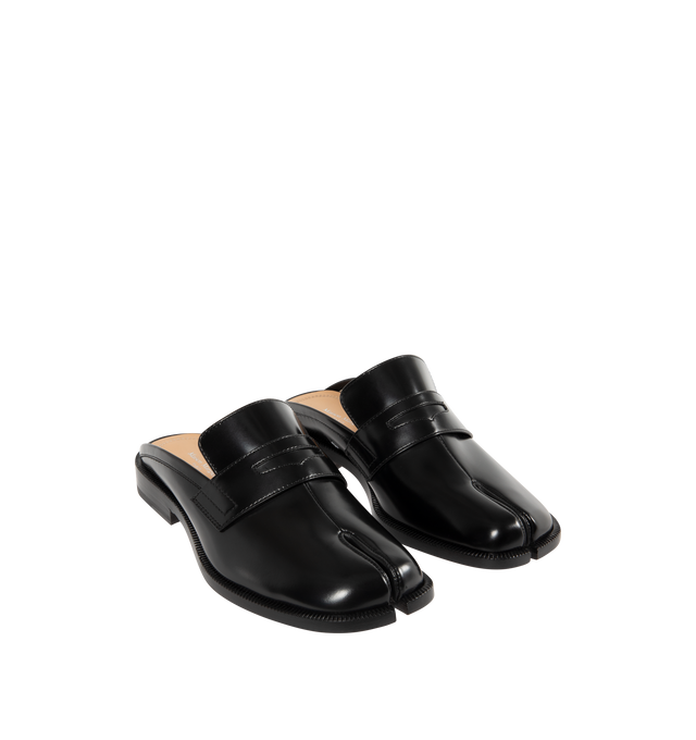 Image 2 of 4 - BLACK - MAISON MARGIELA Tabi City Loafer Mules featuring polished calfskin, slip-on, square cleft toe, strap with cutout at vamp, logo stamp at padded footbed, buffed lambskin lining, serrated edge at welt, stacked leather heel with rubber injection and leather sole. Upper: calfskin. Sole: leather, rubber. Made in Italy.