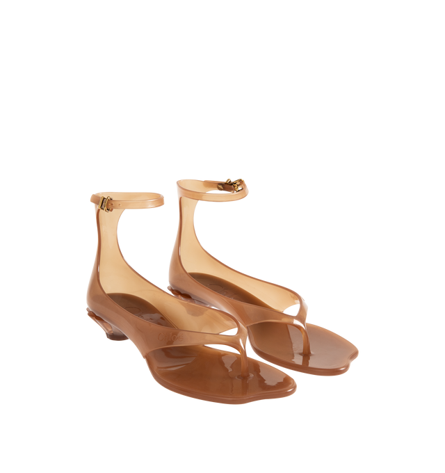 Image 2 of 4 - BROWN - CHLOE Jelly Sandal featuring transparent TPU, thong front with a distinctive wavy sole, shell-shaped heel, adjustable, buckled ankle strap and an oversized tonal Chlo logo on the sole. Sandal heel height: 1". Upper: TPU. Heel: polycarbonate.