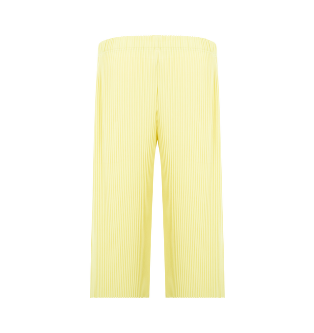 Image 2 of 3 - YELLOW - ISSEY MIYAKE Pant featuring mid-length, quick-drying property, relaxed fit, pleats throughout, pockets on both sides, a drawcord at the waist and a button-fly design. 100% polyester. Made In The Philippines.