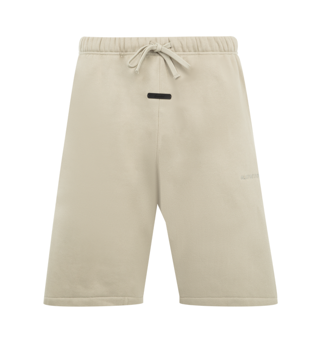 Image 1 of 3 - NEUTRAL - FEAR OF GOD ESSENTIALS Active Trace Relaxed Short featuring drawstring waistband, rubberized logo patch, side seam pockets, embroidered logo and fleece lining. 80% cotton, 20% polyester.