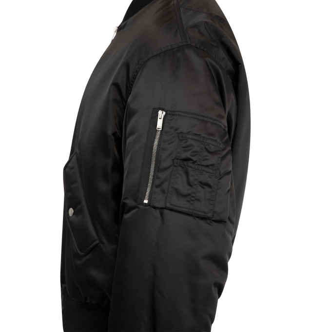 Image 3 of 3 - BLACK - SAINT LAURENT Bomber Jacket made with recycled polyamide featuring ribbed trims, viscose and cotton lining, front zip closure, water-repellent, two jetted pockets with snap-button flap at the front, one zip pocket on the sleeve and baseball collar. 100% polyamide. Made in Italy.