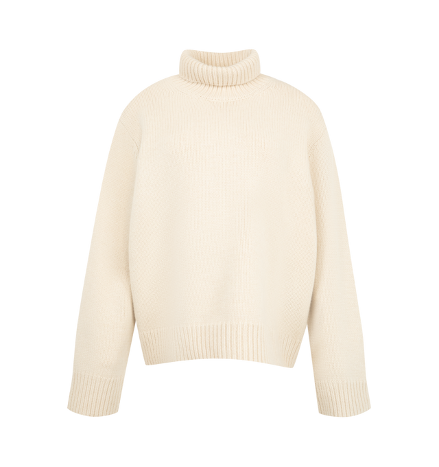 Image 1 of 2 - CREAM - Toteme Women's Oversized Turtleneck Sweater is knitted from a lambswool with a generous silhouette and cocooning, drop-shoulder construction. The high neck creates a sculptural frame while the tapered, ribbed hem and cuffs add structure. Materials: 100% RWS wool.