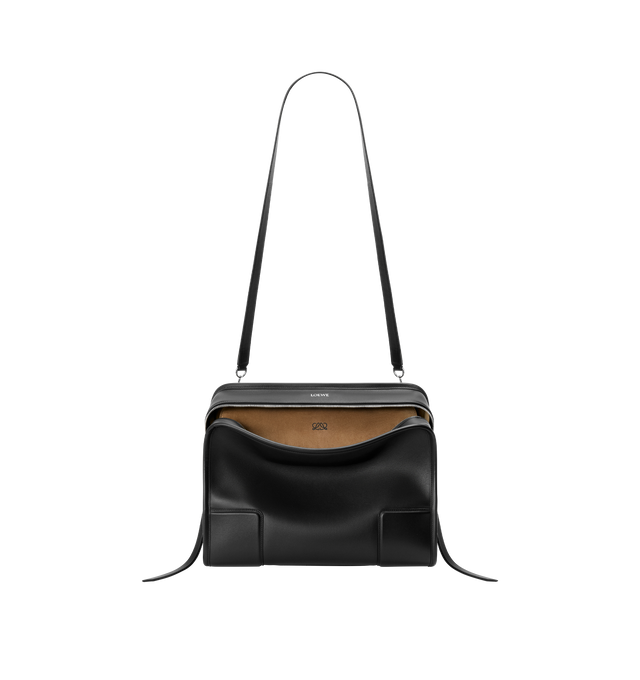 Image 11 of 16 - BLACK - Loewe Amazona 180 large bag takes on a relaxed silhouette anchored by a single toron top handle. It is designed to be carried open, while a concealed closure secures the main compartment. Removable shoulder and crossbody straps make it highly versatile. This large version is crafted in soft calfskin. Three carry options: short handle, removable shoulder strap and crossbody. Features zip closure with two leather zip pullers, two compartments, main compartment closed with magnetic clo