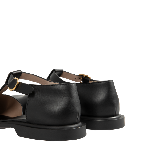 Image 4 of 5 - BLACK - THE ROW Nic T-Strap Flat featuring adjustable buckle closure, t strap and square toe. Leather upper and rubber sole. Made in Italy.