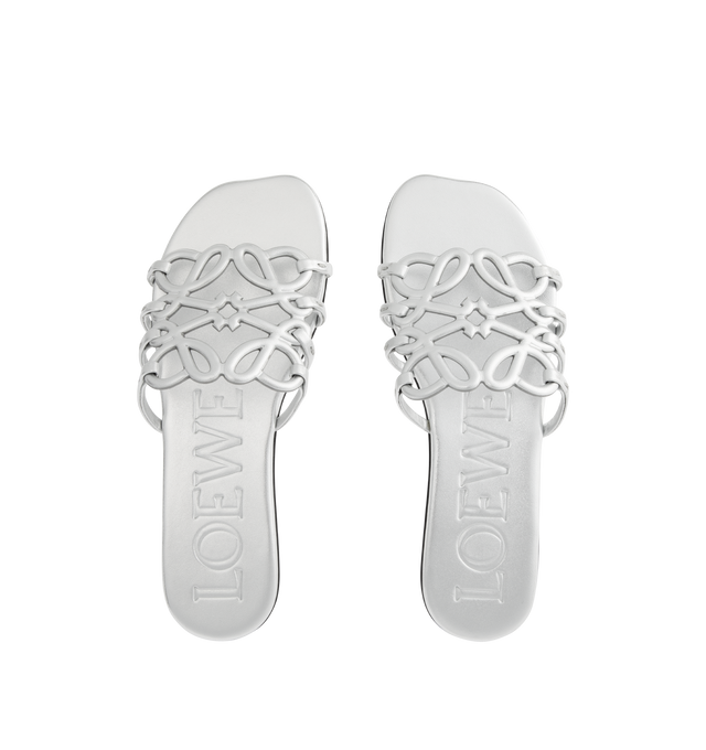 Image 4 of 4 - SILVER - LOEWE Petal Anagram Slide in laminated lambskin featuring a cut-out Anagram upper with hand-painted edges and hand-stitched seams, 5mm heel, embossed LOEWE on the insole, padded leather insole, rubber-injected island on the outsole and hand-stitched seams. Laminated lambskin. Made in Italy.