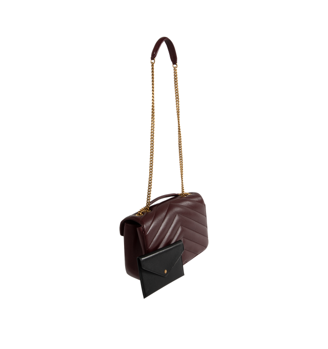 Image 3 of 4 - RED - SAINT LAURENT Loulou Medium Bag featuring chain bag in soft lambskin with chevron-quilted topstitching, removable leather pouch and pocket mirror, sliding chain strap, grosgrain lining, bronze-toned hardware, magnetic snap closure and one flat pocket. 11.4" x 6.7" x 3.1". Single strap drop: 17.7". Doubled strap drop: 8.7". Lambskin, brass. Made in Italy.