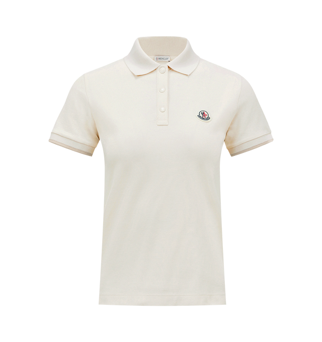 Image 1 of 1 - NEUTRAL - Moncler Women's Polo Shirt featuring cotton piquet, collar, short sleeves, snap button closure, striped cuffs and logo patch. 100% cotton.