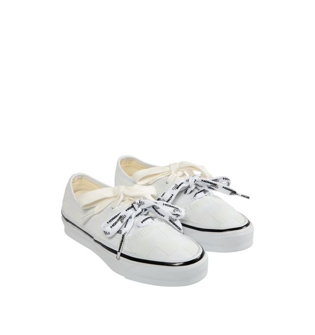 Image 2 of 5 - WHITE - VANS X HOMME GIRLS OTW Authentic 44 Sneaker featuring Heritage low-top shoe, Style 44, 8 oz canvas upper with 6 oz canvas bindings and heel strip, HommeGirls branded lace, with optional second lace, metal eyelets, higher sidewall with gloss finish, foxing tape, reinforced outsoles, Co-branded Foam ADC (All-Day Comfort) insole, signature waffle outsole pattern, all-over checkerboard pattern with Hg monograms and co-branded logo heel scab.