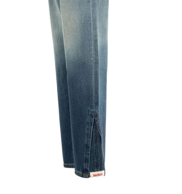 Image 4 of 4 - BLUE - Nahmias Men's High Tide Split Seam Straight Leg Jeans are crafted from 100% cotton denim and feature a straight-leg silhouette with signature split-seam construction. Designed in a medium indigo wash, these designer jeans are finished with a waxed hem that creates a distinctive wet, just-out-of-the-water effect and a Summerland label detail at the split seam. Main Material: 100% Cotton. Fit: Straight Leg. Closure: Button. Details: Waxed Hem, Summerland Label at Split Seam. Care: Profes