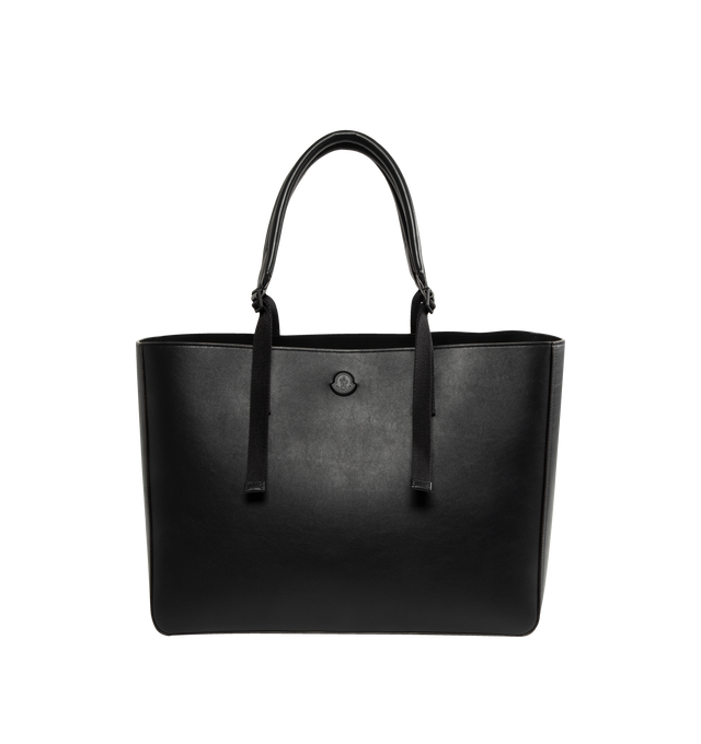 Image 1 of 3 - BLACK - MONCLER Carlo Leather Tote Bag featuring calf leather, micro suede lining, zipped pocket, adjustable leather handles and embossed and metal logo details. L 42 cm X H 31 cm X D 22 cm.