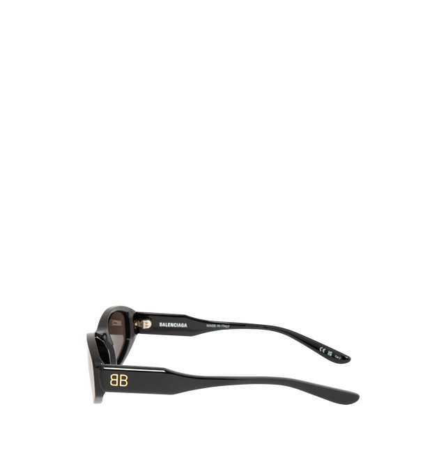 Image 2 of 3 - BLACK - BALENCIAGA Nova Oval Sunglasses featuring Eastman Acetate Renew (40% bio-based, 27% recycled), oval shape, standard fit and BB logo metal plate on both temples. Lens material: Bio-Nylon. 100% UVA/UVB protection. Acetate. Made in Italy.