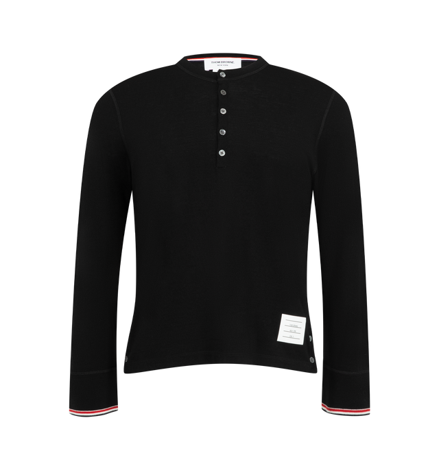 Image 1 of 3 - BLACK - Thom Browne Men's RWB Tipping Stripe Wool Jersey Henley Shirt is crafted from stretch wool jersey and features the brands signature red, white, and blue tipping stripes at the rib-knit cuffs. Designed with a classic Henley silhouette, the shirt is finished with a crewneck, long sleeves, and a button-front placket for a refined everyday look. Main Material: 96% Wool, 4% Elastane. Made in Italy.