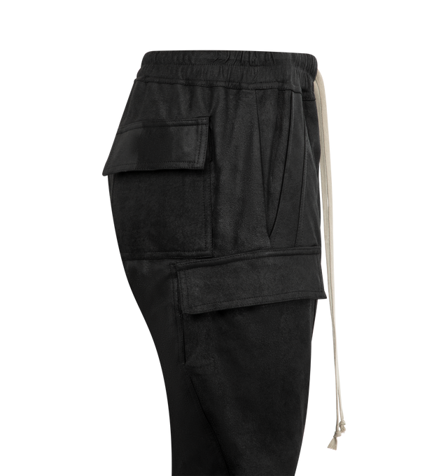Image 3 of 3 - BLACK - RICK OWENS Mastodon Mega Cargo Pants featuring slim-fit cargo pants, drawstring at elasticized waistband, four-pocket styling, button-fly and cargo pockets at outseams. Made in Italy.