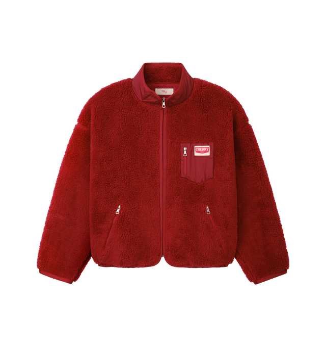 Image 1 of 6 - RED - Cherry LA Zip Up Sherpa Jacket is crafted from custom sherpa fleece and features a boxy-fit silhouette, a full-zip front closure, and zippered pockets for secure storage. Designed with elastic binding at the openings and signature chevron labels at the pockets, this cozy layer combines everyday comfort with clean utilitarian detailing. Main Material: Custom Sherpa Fleece