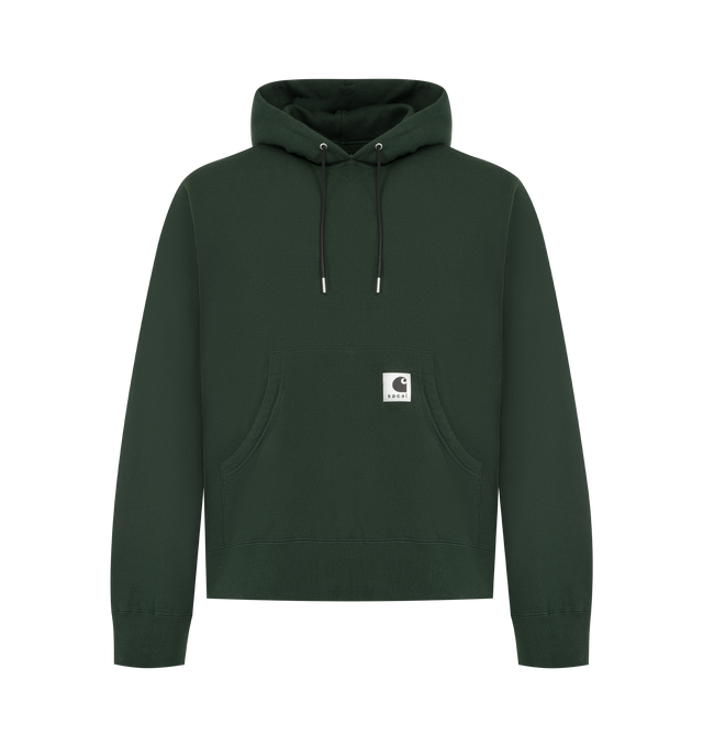 Image 1 of 3 - GREEN - SACAI X CARHARTT WIP Cotton Hoodie featuring a heavyweight cotton jersey fabric with a soft, brushed cotton pile lining, garment-washed for a unique, worn-in appearance, hooded drawstring neckline, kangaroo pocket with co-branded woven label, long sleeves, ribbed cuffs and hem and pullover style. Cotton/polyurethane. Made in Japan.