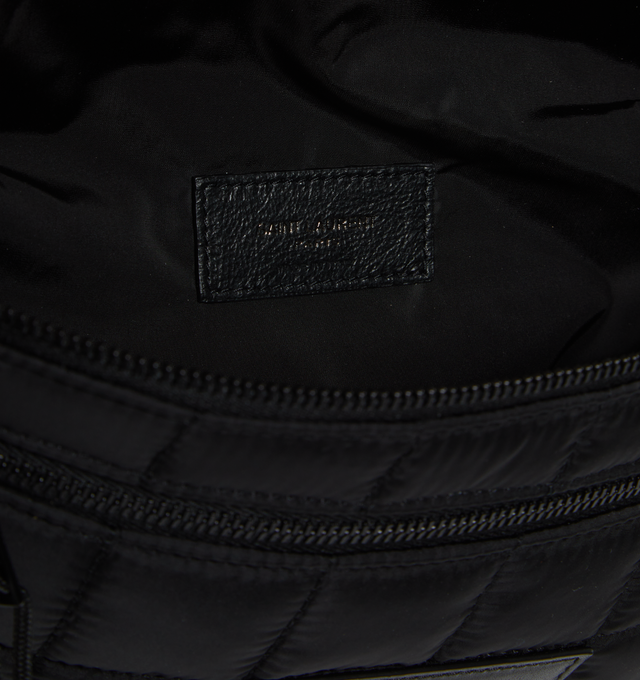 Image 3 of 3 - BLACK - SAINT LAURENT Nuxx Crossbody bag featuring quilted ECONYL, two zippered pouches, three flat zipped pockets with shoelace pulls, embossed leather label on front, adjustable clip buckle closure, one zip pocket at back and one zip pocket at front. 95% polyamide, 5% metal. 