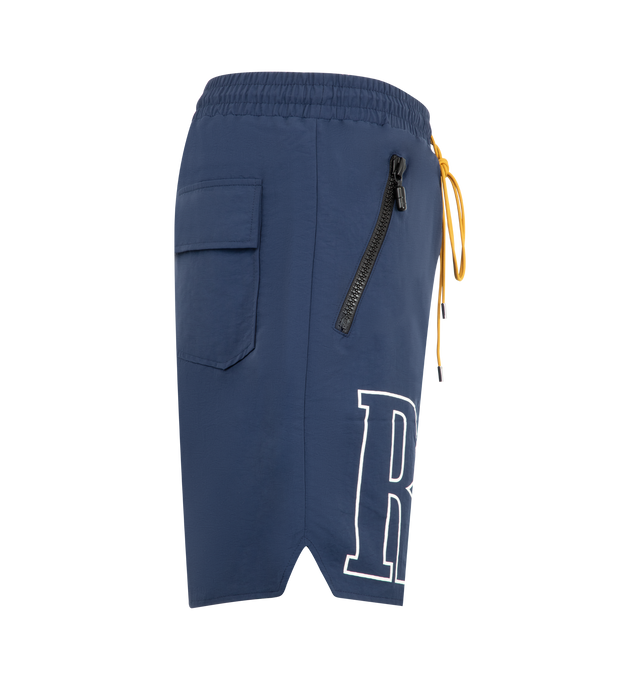 Image 3 of 3 - BLUE - Rhude Mens Nylon Shorts are crafted from premium washed nylon. Feature logo print across the front legs, twin zip pockets with tonal Rhude Pill hardware, and extended drawstrings in signature mustard tone. Main Material: 100% Nylon. Made in the USA.