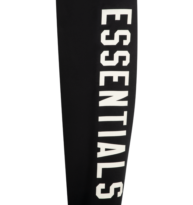 Image 3 of 4 - BLACK - FEAR OF GOD ESSENTIALS Lounge Fleece Sweatpant featuring lounge fit, oversized, voluminous leg and seat, "Essentials" screenprint logo, encased elastic waistband, heavyweight drawstring with rubberized tip, side seam pockets and "Fear of God Essentials" translucent rubberized label. 80% cotton, 20% polyester fleece.
