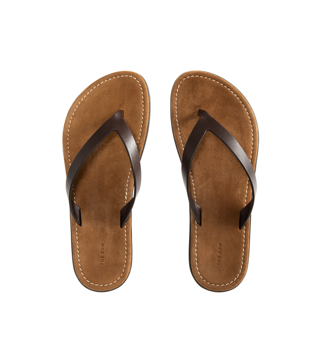 Image 4 of 4 - BROWN - THE ROW Beach Flip Flop featuring vegetable-tanned calfskin leather with seamless strap, padded goatskin insole and rubber sole. 100% calfskin leather. Synthetic sole. Made in Italy.