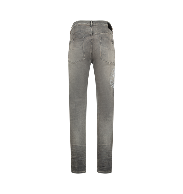 Image 2 of 3 - GREY - AMIRI Hollywood MX1 Jeans featuring used-effect stonewashed stretch cotton denim jeans with exposed ribbed suede repair, logo embroidery on the right leg, front button closure, five pockets and suede logo tag. 92% cotton, 6% elastomultiester, 2% elastane. Made in Italy.