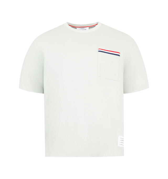 Image 1 of 3 - GREY - THOM BROWNE Textured Cotton Linen Tee featuring a cotton-linen blend, waffled exterior, ribbed neckline, patch chest pocket with knit RWB trim, buttoned side vents with RWB grosgrain trim, stepped hem, name tag appliqu and signature striped grosgrain loop tab. 55% cotton, 36% linen, 7% polyamide, 2% elastane.