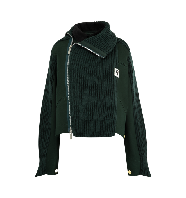Image 1 of 4 - GREEN - Sacai x Carhartt WIP Women's Duck x Wool Knit Blouson is a hybrid of Carhartt WIPs Detroit Jacket and sacais knit blouson. Featuring two front layers on the body and sleeves, made from Carhartt WIPs duck canvas fabric, with rib-knit, spun wool and nylon yarn, an asymmetric front opening with a double zipper, and a high neck that can be worn up or down to form a flat collar, and co-branded woven label. A co-branded woven label appears on the front. Organic cotton canvas, Knit material