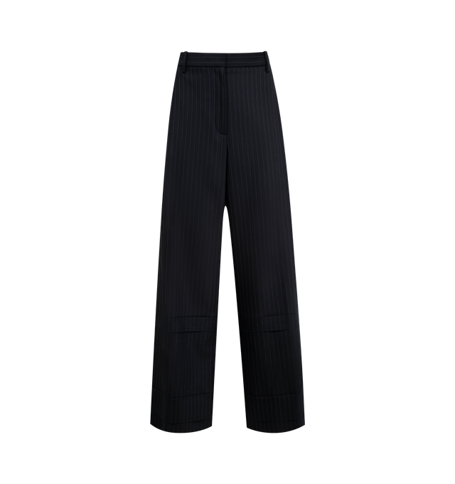 Image 1 of 3 - NAVY - KHAITE Linden Pant featuring a relaxed, wide-leg pant that reflects a deconstructive impulse with raw-edge paneling below the knee and pocket built into front pleat for a smooth fit. 96% virgin wool, 2% elastane, 2% cotton.