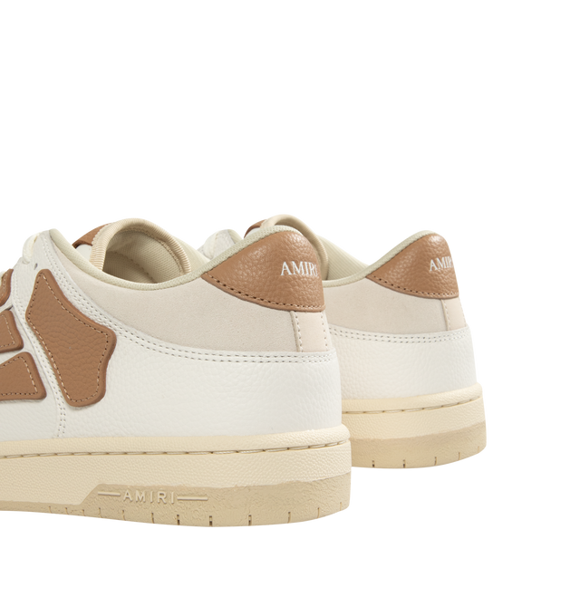 Image 3 of 5 - BROWN - AMIRI Skel Top Low Sneakers featuring low-top grained leather and cotton twill sneakers, perforations at toe, logo patch at padded tongue, padded collar, graphic appliqus at sides and logo printed at heel tab. Upper: leather, textile. Sole: rubber.