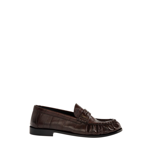 Image 1 of 4 - BROWN - Saint Laurent Mens Penny Loafers are crafted from supple eel skin leather. Feature a hand-stitched moc toe, gold-tone Cassandre hardware, classic penny loafer silhouette, and leather sole. Main Material: Eel Skin Leather; Hardware: Brass; Sole: Leather. Made in Italy.
