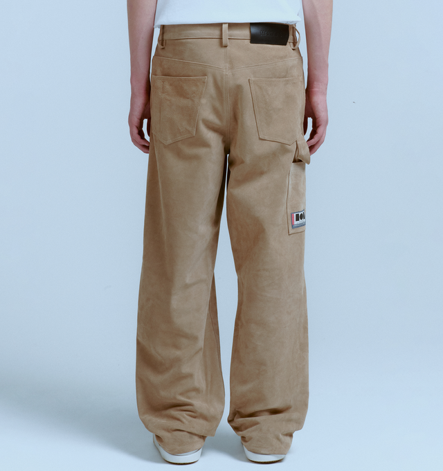Image 3 of 5 - BROWN - NAHMIAS Suede Baggy Carpenter Pant featuring button zip closure, belt loops at waist, 5 pocket style with carpenter pocket at outseam and hammer loop. 100% leather.