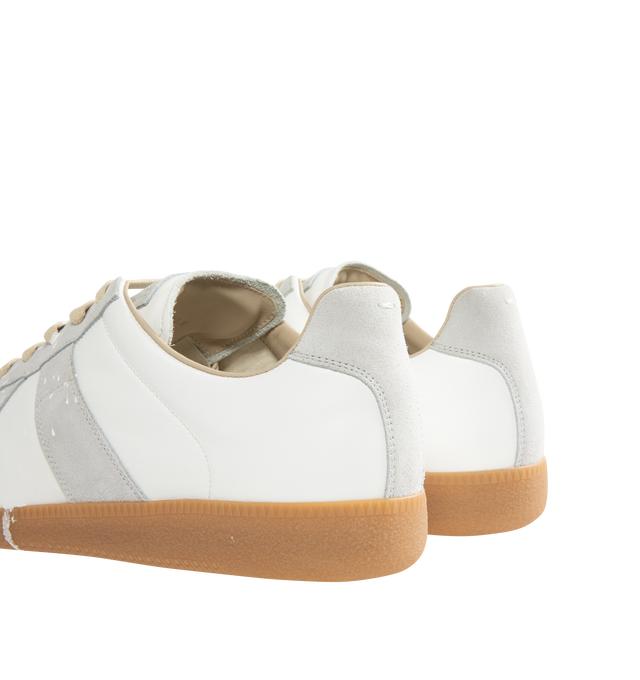 Image 3 of 5 - WHITE - MAISON MARGIELA Replica Sneakers featuring a classic low-top silhouette, contrast of matte leather and a patent sprayed finish, paint splatter detail, lace-up construction and rubber sole. Made in Italy.