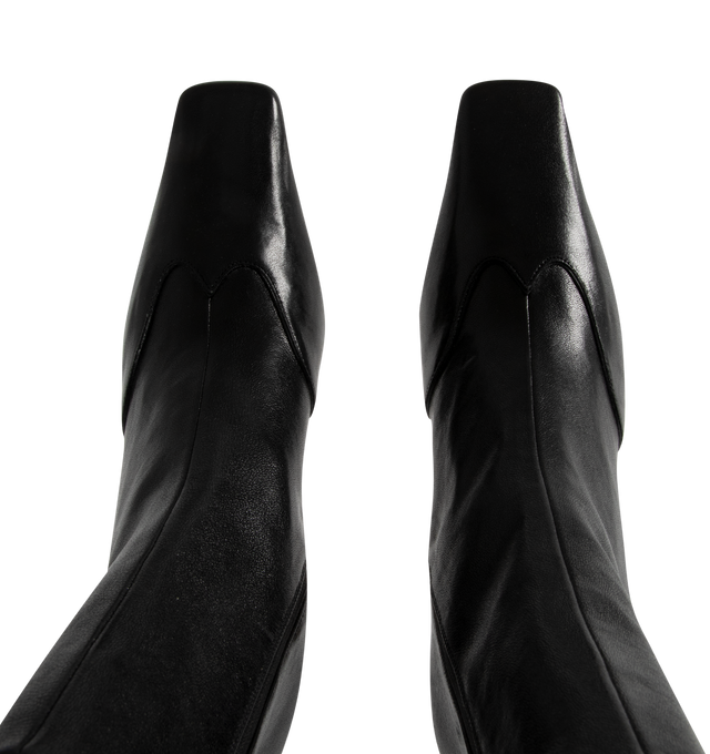 Image 4 of 4 - BLACK - KHAITE Nevada Stretch High Boot featuring a mid-calf urban cowboy boot with a squared toe, a stylized wingtip traced by tonal topstitching and a side zipper closure. Heel Height: 3.4 in. 100% lambskin. Made in Italy.