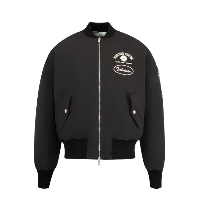 Image 1 of 4 - BLACK - MARKET Handyman Reversible Bomber Jacket featuring a reversible design with a solid and camo print, a full zipper front closure, long sleeves, side hand pockets, and a ribbed collar, cuffs, and hem for a classic look. Nylon.