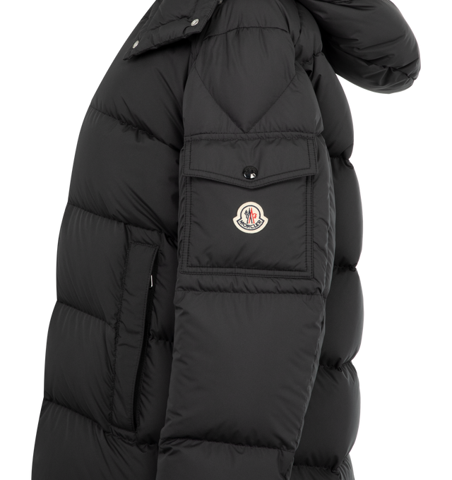 Image 3 of 4 - BLACK - MONCLER Maya 70 Hooded Short Down Jacket featuring recycled polyester, polyester lining, down-filled, detachable and adjustable hood, zipper and snap button closure, zipped pockets, sleeve pocket with snap button closure, adjustable cuffs, hem with drawstring fastening and logo. 100% polyester. Padding: 90% down, 10% feather.